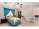 Cozy bedroom featuring a ceiling fan, closet, and carpeted floor at 1339 E Silverbrush Trl, Casa Grande, AZ 85122