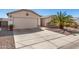 Attractive single-level home with a two-car garage, low maintenance desert landscaping and concrete driveway at 1339 E Silverbrush Trl, Casa Grande, AZ 85122