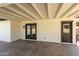 Covered patio with access to the pool through French doors and a convenient service door at 1504 E Jasmine St, Mesa, AZ 85203