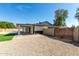 Spacious backyard featuring desert landscaping, a pool, and a covered patio area at 1504 E Jasmine St, Mesa, AZ 85203