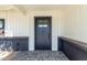 Close-up of front door featuring a dark-painted finish and a stylish, modern design at 1504 E Jasmine St, Mesa, AZ 85203