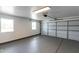 Clean, painted garage with epoxy flooring and natural light from 2 windows at 1504 E Jasmine St, Mesa, AZ 85203