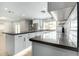 Kitchen with stone countertops, an island, and modern cabinetry at 1504 E Jasmine St, Mesa, AZ 85203