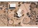 Overhead view of a desert property featuring the house, garage, and horse pen at 16835 E Skinner Dr, Rio Verde, AZ 85263