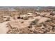 Aerial view of a custom home with horse property surrounded by desert landscape at 16835 E Skinner Dr, Rio Verde, AZ 85263