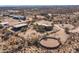 Aerial view of the property, showing the house, horse facilities, and the surrounding desert landscape at 16835 E Skinner Dr, Rio Verde, AZ 85263