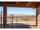 View from the barn interior showcases a distant mountain vista and scenic desert landscape at 16835 E Skinner Dr, Rio Verde, AZ 85263