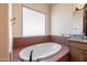 Bathroom with soaking tub and large window at 16835 E Skinner Dr, Rio Verde, AZ 85263