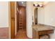 Bathroom featuring granite vanity, decorative mirror, and tiled shower with decorative ladder at 16835 E Skinner Dr, Rio Verde, AZ 85263