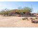 Desert property featuring low-maintenance landscaping, natural vegetation, and a southwestern-style home with private balcony at 16835 E Skinner Dr, Rio Verde, AZ 85263