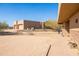 Tan home exterior featuring stone accents and desert landscaping on a sunny day at 16835 E Skinner Dr, Rio Verde, AZ 85263