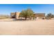 Exterior view of desert home with xeriscaping in circular driveway at 16835 E Skinner Dr, Rio Verde, AZ 85263