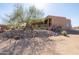 Expansive property showcasing desert landscaping, native trees, and a southwestern-style home with private balcony at 16835 E Skinner Dr, Rio Verde, AZ 85263