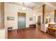 Elegant foyer with rustic wood columns, Saltillo tile, and wooden doors at 16835 E Skinner Dr, Rio Verde, AZ 85263