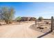 Desert home with dirt drive, gated entrance, and natural desert landscaping at 16835 E Skinner Dr, Rio Verde, AZ 85263