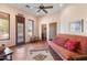 Cozy living room featuring a futon, southwestern decor, and a view of the outdoors at 16835 E Skinner Dr, Rio Verde, AZ 85263