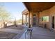 Covered patio with outdoor seating overlooking scenic desert landscape at 16835 E Skinner Dr, Rio Verde, AZ 85263