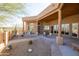 Outdoor covered patio with desert landscaping, providing a relaxing atmosphere at 16835 E Skinner Dr, Rio Verde, AZ 85263