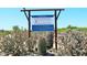 Sign for Southwest Wildlife Conservation Center with cactus in the foreground at 16835 E Skinner Dr, Rio Verde, AZ 85263