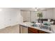 Open kitchen showcasing granite countertops and stainless steel dishwasher flowing into the living area at 1950 N Center St # 111, Mesa, AZ 85201