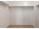 Walk-in closet featuring neutral carpet and shelving at 1950 N Center St # 111, Mesa, AZ 85201