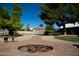 Backyard fire pit and basketball court with mature trees at 20212 E Appaloosa Dr, Queen Creek, AZ 85142