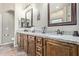 Bathroom with granite countertops, dual sinks, and wood cabinets at 20212 E Appaloosa Dr, Queen Creek, AZ 85142