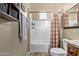 Bathroom featuring a shower-tub combination, granite countertop, and wooden cabinetry at 20212 E Appaloosa Dr, Queen Creek, AZ 85142