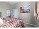 Bedroom featuring a queen bed, closet, and artwork at 20212 E Appaloosa Dr, Queen Creek, AZ 85142