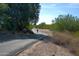 A lone biker enjoys the scenic paved path on a sunny day at 20212 E Appaloosa Dr, Queen Creek, AZ 85142