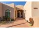 Inviting entryway featuring a decorative front door and arched doorway at 20212 E Appaloosa Dr, Queen Creek, AZ 85142