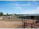 Horse pen with fencing with a horse inside provides a safe space for grazing with mountain views at 20212 E Appaloosa Dr, Queen Creek, AZ 85142