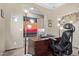 Well-lit home office with a large desk, comfortable seating, and unique decorative accents at 20212 E Appaloosa Dr, Queen Creek, AZ 85142