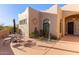 Private outdoor patio with dining set and desert landscaping for relaxing and entertaining at 20212 E Appaloosa Dr, Queen Creek, AZ 85142