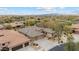 Expansive aerial view of desert home featuring a tile roof, desert landscaping, and a three-car garage, complete with a circular driveway at 2025 W Calle Del Sol --, Phoenix, AZ 85085