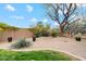 Serene backyard featuring gravel landscaping, mature trees, and comfortable outdoor seating at 2025 W Calle Del Sol --, Phoenix, AZ 85085