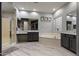 Modern bathroom featuring dual vanities, a soaking tub, and a glass-enclosed shower at 2025 W Calle Del Sol --, Phoenix, AZ 85085