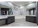 The primary bathroom includes dual vanities with marble countertops, a soaking tub and a glass-enclosed shower at 2025 W Calle Del Sol --, Phoenix, AZ 85085