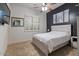 An inviting bedroom featuring plantation shutters and natural light at 2025 W Calle Del Sol --, Phoenix, AZ 85085