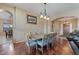 Formal dining room featuring a spacious dining set and hardwood floors at 2025 W Calle Del Sol --, Phoenix, AZ 85085