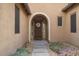 Inviting home entrance with decorative door and manicured front garden at 2025 W Calle Del Sol --, Phoenix, AZ 85085