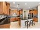 Well-equipped kitchen featuring granite counters, stainless steel appliances, and custom cabinets at 2025 W Calle Del Sol --, Phoenix, AZ 85085