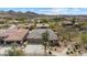 This street-view features a desert home with a three-car garage, tile roof, desert landscaping and mountain views at 2025 W Calle Del Sol --, Phoenix, AZ 85085