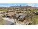 This street-view features a desert home with a three-car garage, tile roof, desert landscaping and mountain views at 2025 W Calle Del Sol --, Phoenix, AZ 85085