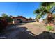 Backyard featuring a large patch of dry grass and a few plants at 2144 W Joan De Arc Ave, Phoenix, AZ 85029