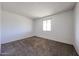 Bedroom with carpet flooring and a window providing plenty of natural light at 2144 W Joan De Arc Ave, Phoenix, AZ 85029