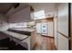 Cozy kitchen boasting white cabinets, ample counter space, and a built-in oven at 2144 W Joan De Arc Ave, Phoenix, AZ 85029