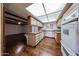 Bright kitchen with white appliances, white cabinets, and an attached dining area at 2144 W Joan De Arc Ave, Phoenix, AZ 85029