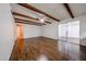 Spacious living room featuring ceiling fan, new vinyl flooring, and white walls at 2144 W Joan De Arc Ave, Phoenix, AZ 85029