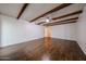 Large living room with wood beam and vinyl floors at 2144 W Joan De Arc Ave, Phoenix, AZ 85029